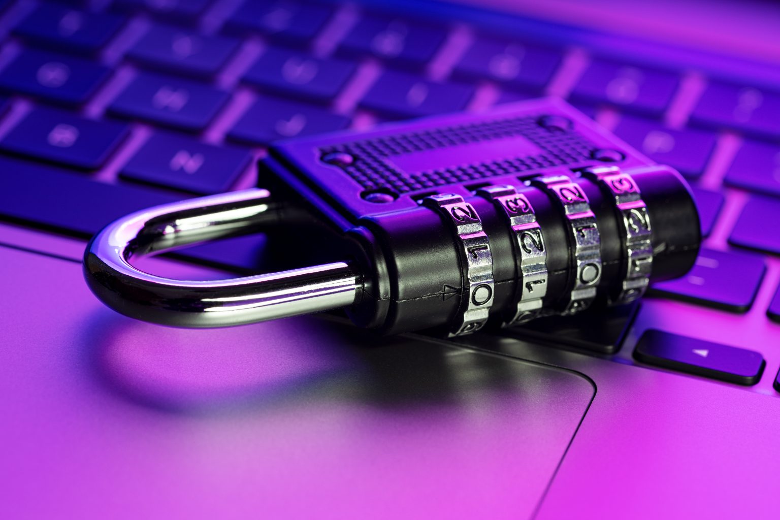 Computer Security protection concept. Closed padlock on laptop with colorful lights